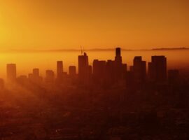 Warm orange sunset behind the skyline of Los Angeles. Original public domain image from Wikimedia Commons