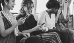 Group of diverse people using smartphones