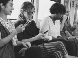 Group of diverse people using smartphones